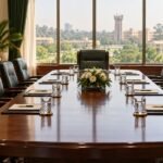 University boardroom prepared for a formal meeting